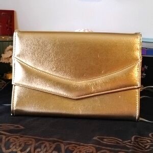 Bright as the sun gold clutch.